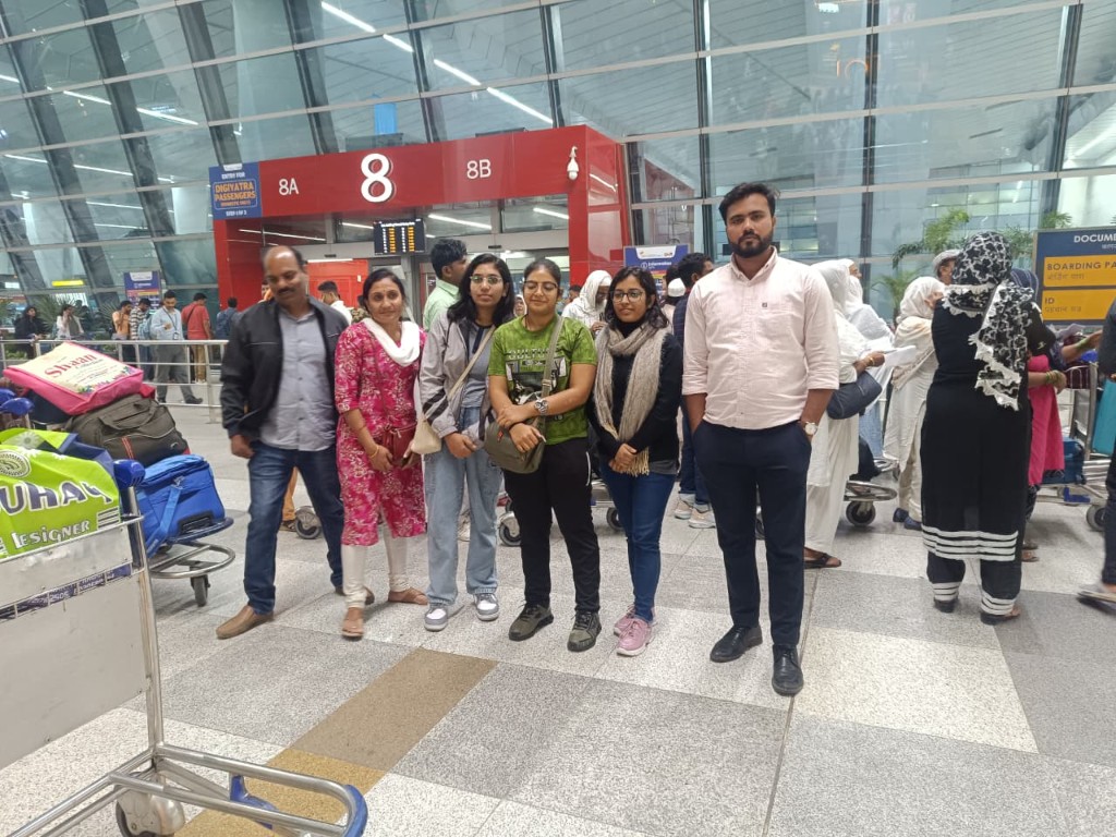 Dr. Noman with students at the airport
